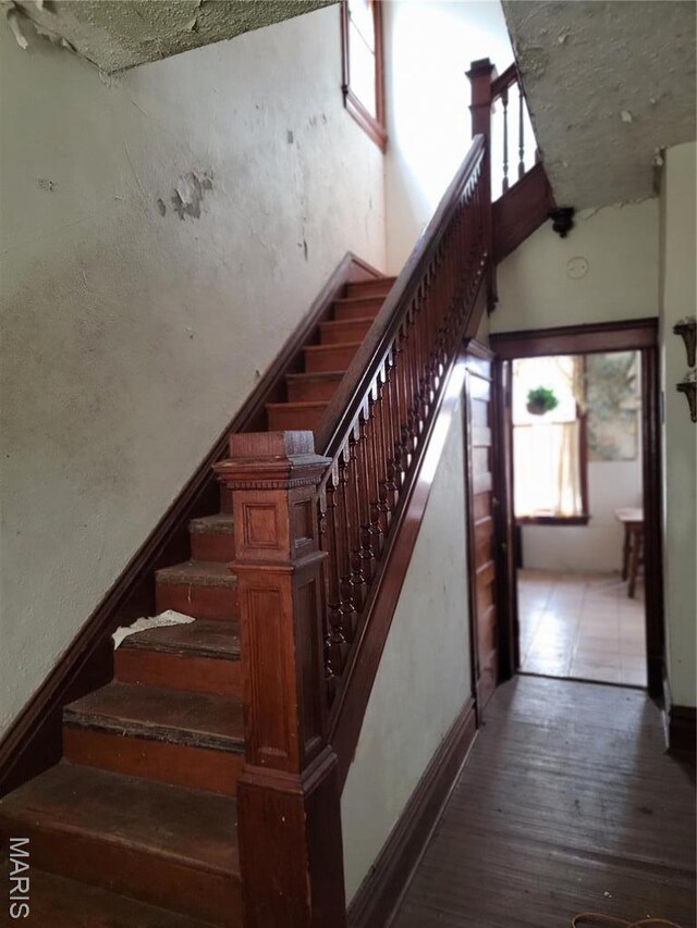 4453 Athlone Ave, Saint Louis, MO 63115 - stairs with wood finished floors and baseboards