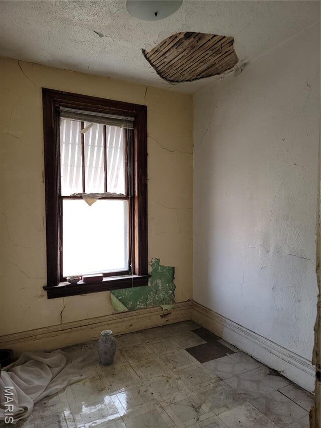4453 Athlone Ave, Saint Louis, MO 63115 - empty room with tile patterned floors