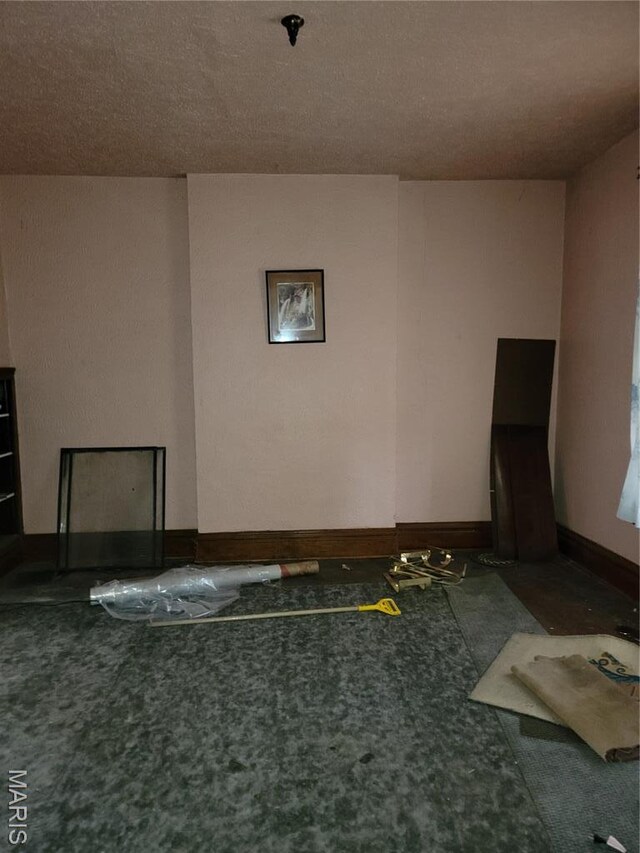 4453 Athlone Ave, Saint Louis, MO 63115 - unfurnished room with a pendent fire sprinkler, baseboards, and carpet floors