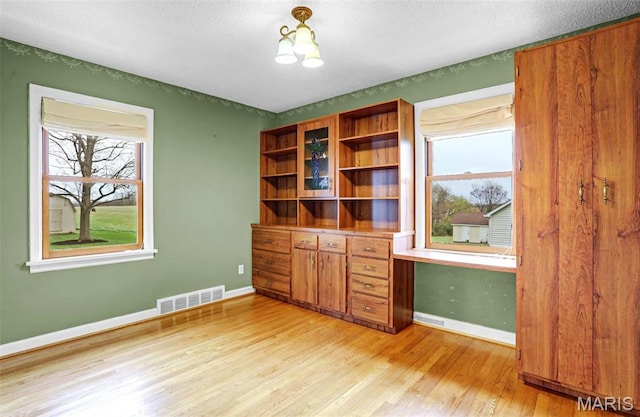 765 Pottery Tower Ln, Washington, MO 63090 - unfurnished office with light wood-style floors, plenty of natural light, and baseboards