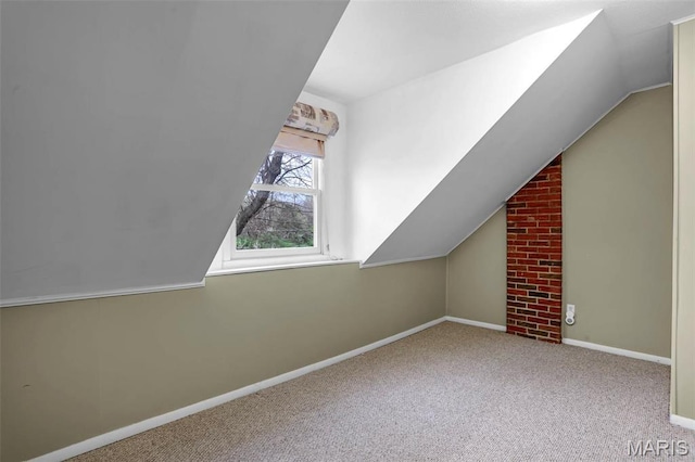765 Pottery Tower Ln, Washington, MO 63090 - additional living space with vaulted ceiling, carpet flooring, and baseboards