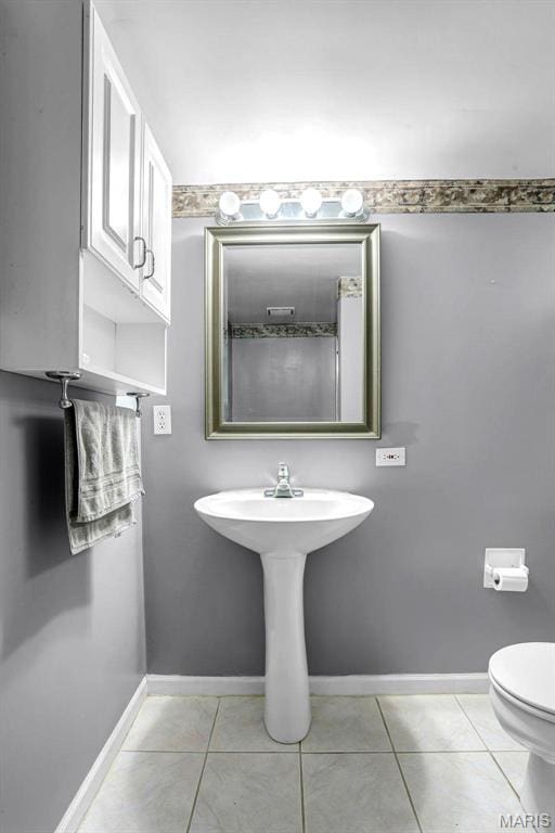 765 Pottery Tower Ln, Washington, MO 63090 - bathroom featuring baseboards, tile patterned flooring, and toilet
