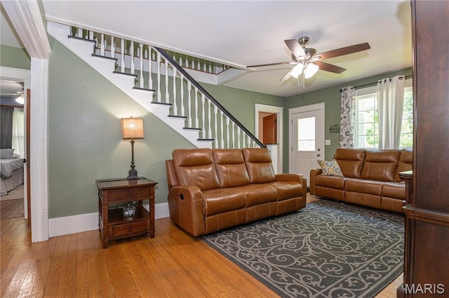 110 W Scioto St, St James, MO 65559 - living area with a ceiling fan, stairway, and hardwood / wood-style floors