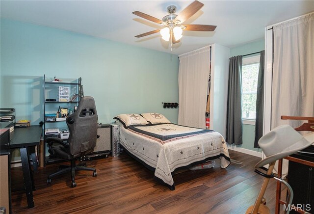 110 W Scioto St, St James, MO 65559 - bedroom with wood finished floors, an office area, and a ceiling fan