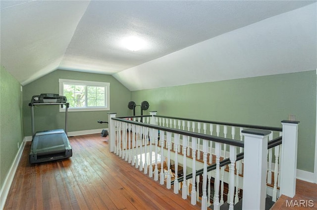 110 W Scioto St, St James, MO 65559 - workout room featuring hardwood / wood-style floors and vaulted ceiling