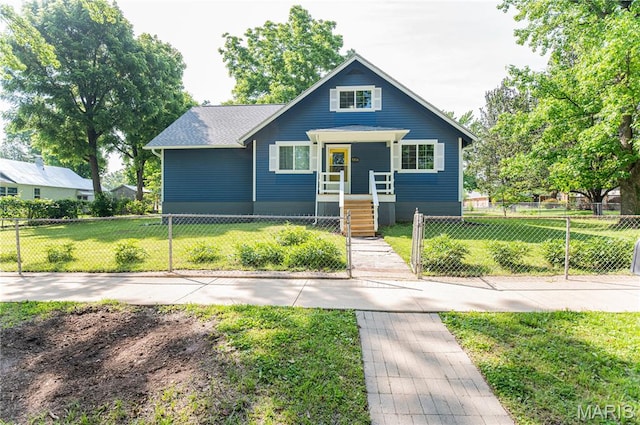 110 W Scioto St, St James, MO 65559 - bungalow-style home with a fenced front yard and roof with shingles