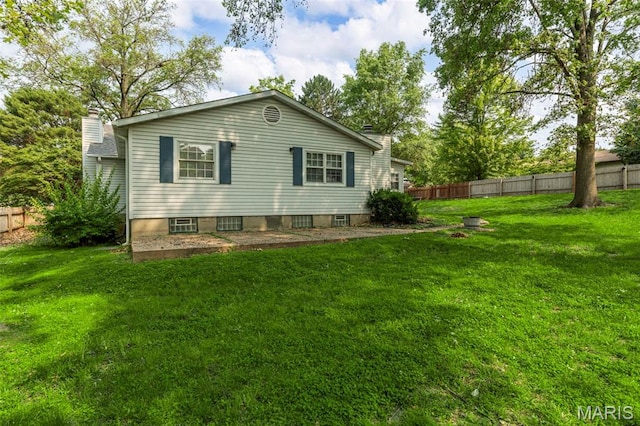 1064 Pinecone Trl, Florissant, MO 63031 - rear view of property with a chimney