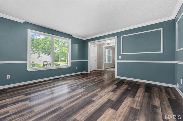 1064 Pinecone Trl, Florissant, MO 63031 - empty room featuring a textured ceiling, wood finished floors, baseboards, and crown molding