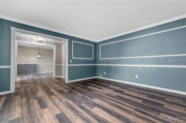 1064 Pinecone Trl, Florissant, MO 63031 - spare room with wood finished floors, ornamental molding, baseboards, a textured ceiling, and a chandelier