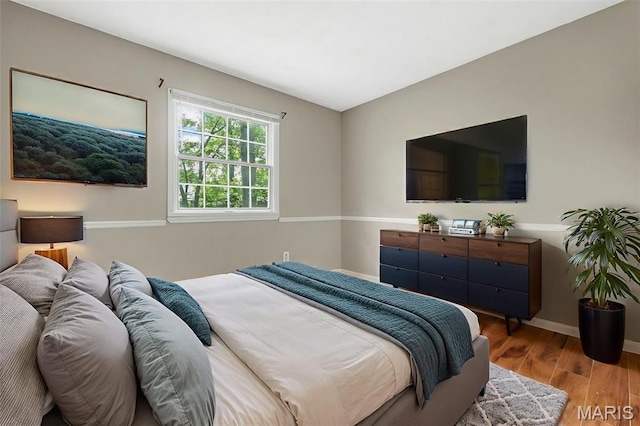 1064 Pinecone Trl, Florissant, MO 63031 - bedroom featuring wood finished floors and baseboards