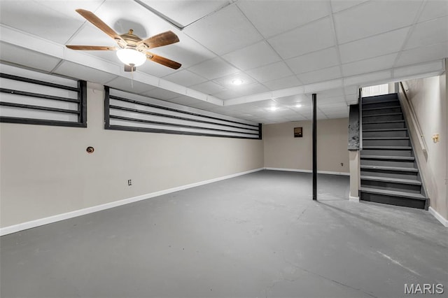 1064 Pinecone Trl, Florissant, MO 63031 - finished below grade area featuring stairs, baseboards, a paneled ceiling, and ceiling fan