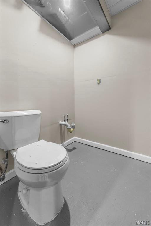 1064 Pinecone Trl, Florissant, MO 63031 - bathroom featuring toilet, concrete flooring, and baseboards