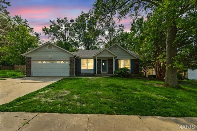 1064 Pinecone Trl, Florissant, MO 63031 - ranch-style house featuring an attached garage, driveway, a front yard, and brick siding