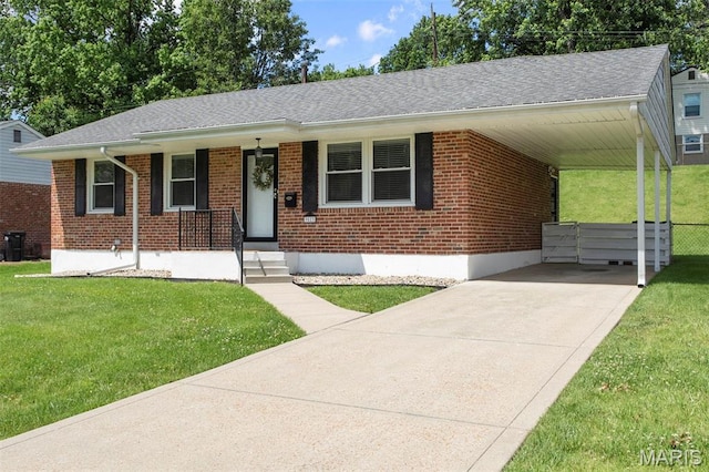 9523 Hale Dr, Saint Louis, MO 63123 - view of front facade featuring brick siding, driveway, a front yard, and a carport