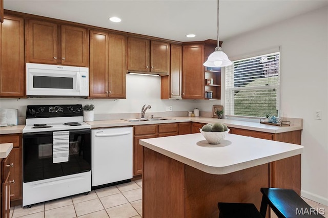 9523 Hale Dr, Saint Louis, MO 63123 - kitchen with white appliances, a sink, brown cabinetry, light countertops, and recessed lighting