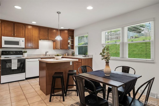 9523 Hale Dr, Saint Louis, MO 63123 - kitchen with white appliances, open shelves, light countertops, a center island, and recessed lighting