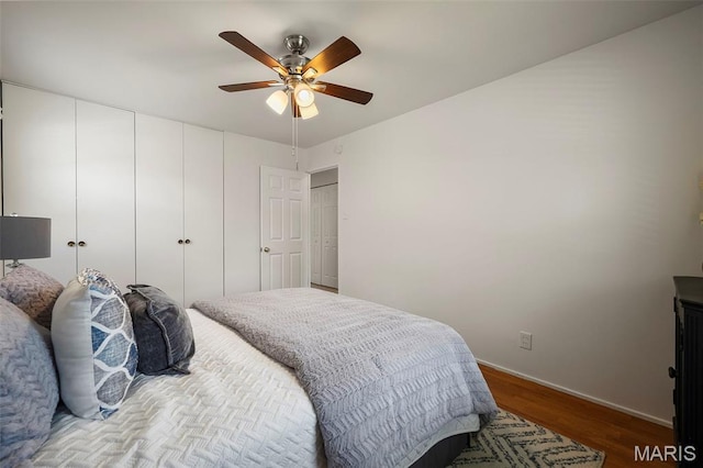 9523 Hale Dr, Saint Louis, MO 63123 - bedroom with wood finished floors, baseboards, and a ceiling fan