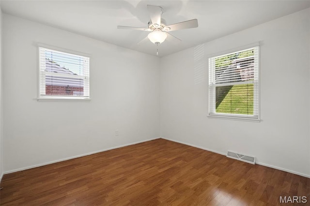 9523 Hale Dr, Saint Louis, MO 63123 - spare room with plenty of natural light, wood finished floors, baseboards, and ceiling fan