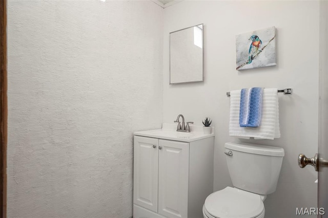 9523 Hale Dr, Saint Louis, MO 63123 - half bathroom with vanity and toilet