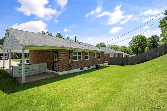9523 Hale Dr, Saint Louis, MO 63123 - back of property featuring roof with shingles, central air condition unit, and brick siding