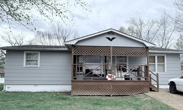 388 Colby St, Bourbon, MO 65441 - back of property with a deck, a shingled roof, and a yard