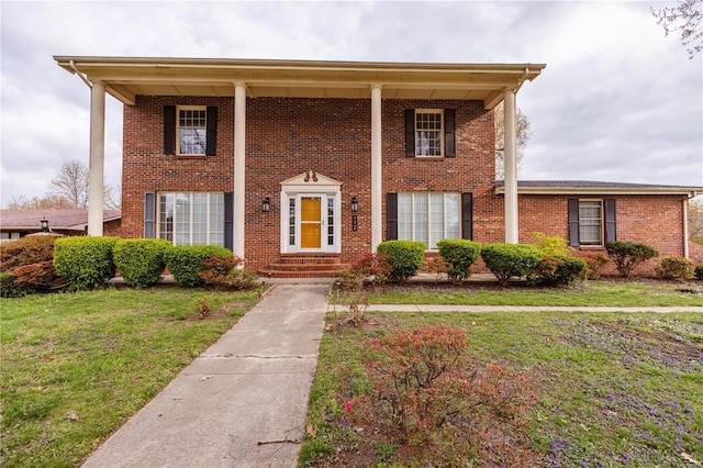 112 Summer Dr, Sikeston, MO 63801 - neoclassical home with a front lawn and brick siding