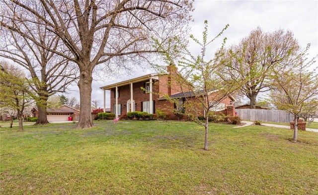 112 Summer Dr, Sikeston, MO 63801 - greek revival house featuring brick siding and a chimney