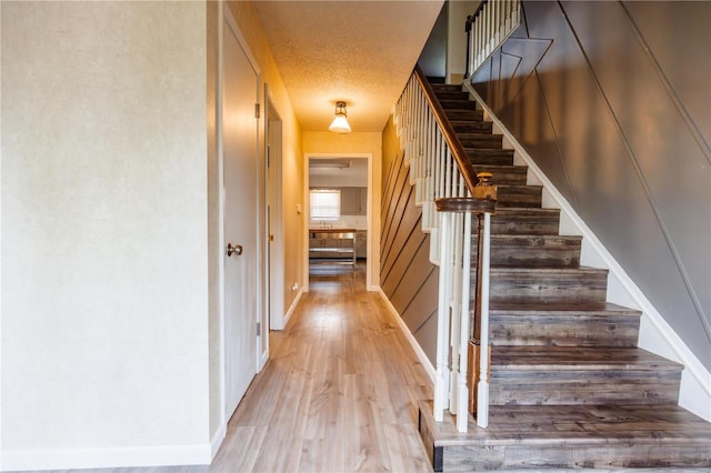 112 Summer Dr, Sikeston, MO 63801 - stairway featuring wood finished floors and baseboards