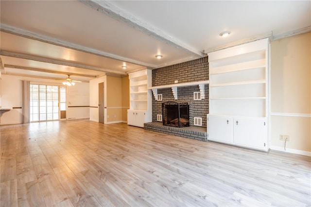 112 Summer Dr, Sikeston, MO 63801 - unfurnished living room featuring beam ceiling, a fireplace, ceiling fan, light wood-type flooring, and baseboards