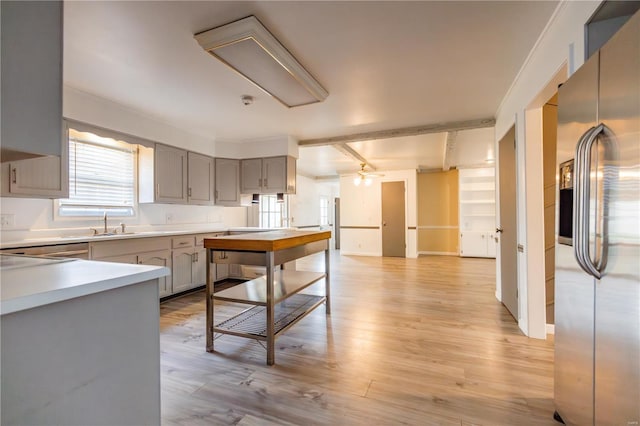 112 Summer Dr, Sikeston, MO 63801 - kitchen featuring stainless steel fridge with ice dispenser, gray cabinets, a ceiling fan, light wood finished floors, and light countertops
