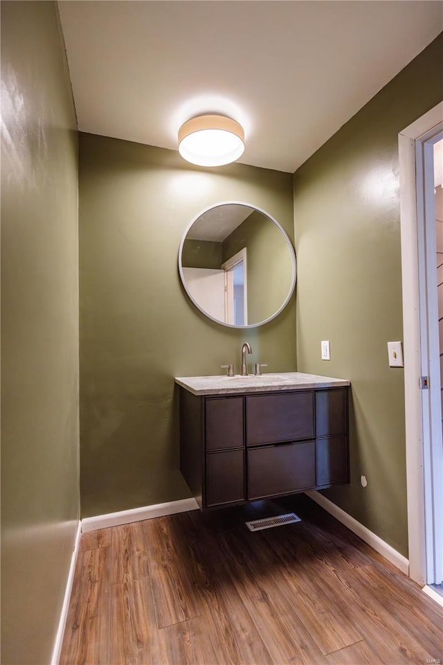 112 Summer Dr, Sikeston, MO 63801 - bathroom with wood finished floors, baseboards, and vanity