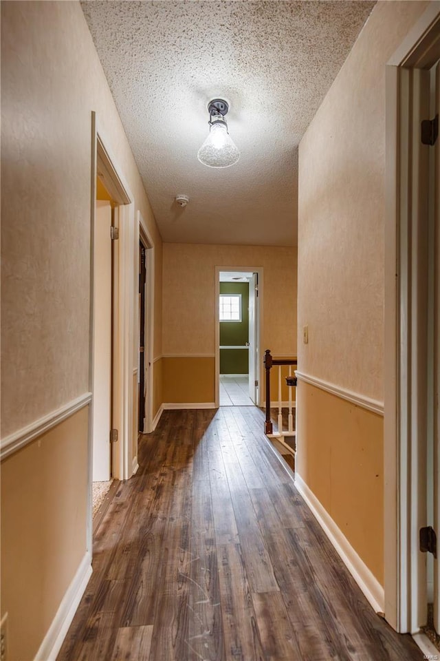 112 Summer Dr, Sikeston, MO 63801 - corridor with wood finished floors and a textured ceiling