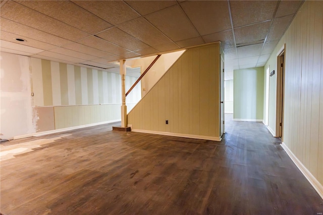 112 Summer Dr, Sikeston, MO 63801 - finished basement featuring dark wood-style flooring, stairs, baseboards, and wooden walls
