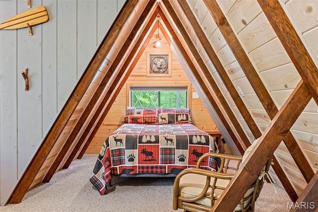 bedroom featuring wood walls, lofted ceiling, and carpet