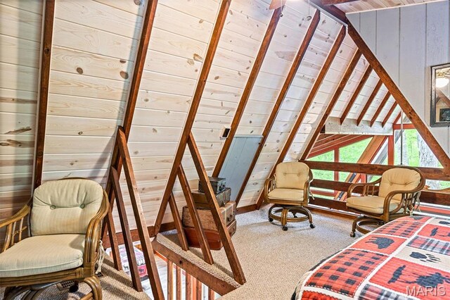 bedroom with carpet flooring, wooden ceiling, wooden walls, and lofted ceiling