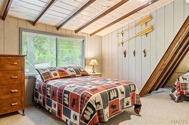 carpeted bedroom featuring wooden walls, beam ceiling, and wood ceiling