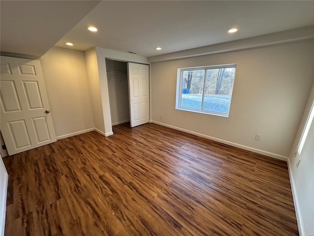 1612 California Ave, Collinsville, IL 62234 - unfurnished bedroom featuring baseboards, dark wood-style floors, recessed lighting, and a closet