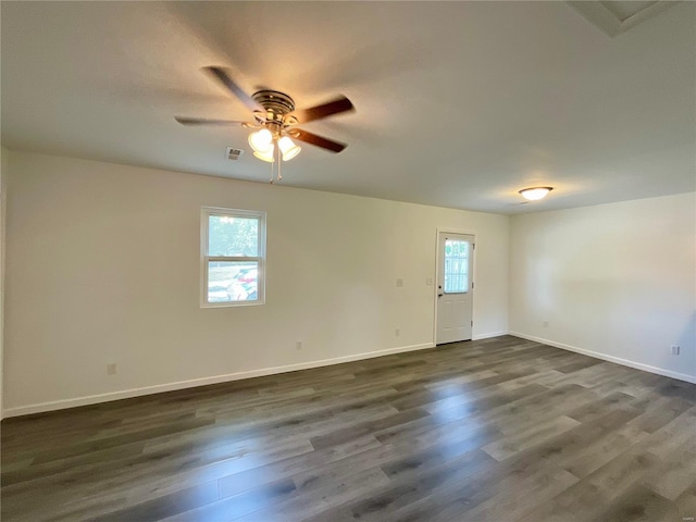 1612 California Ave, Collinsville, IL 62234 - unfurnished room featuring a ceiling fan, dark wood-style floors, and baseboards