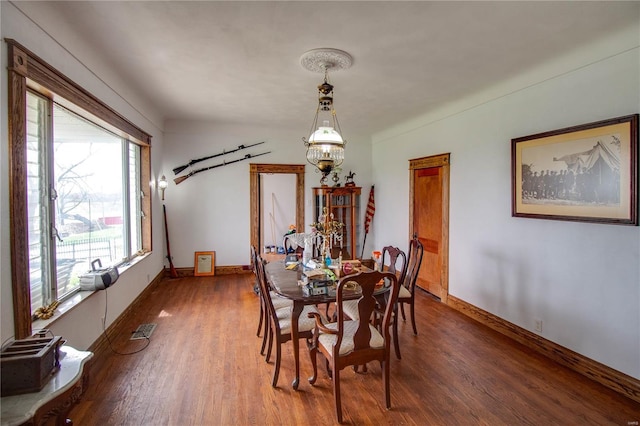 1508 State Route 140, Smithboro, IL 62284 - dining area featuring a chandelier, wood finished floors, and baseboards
