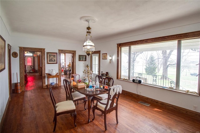 1508 State Route 140, Smithboro, IL 62284 - dining space with wood finished floors, a chandelier, and baseboards