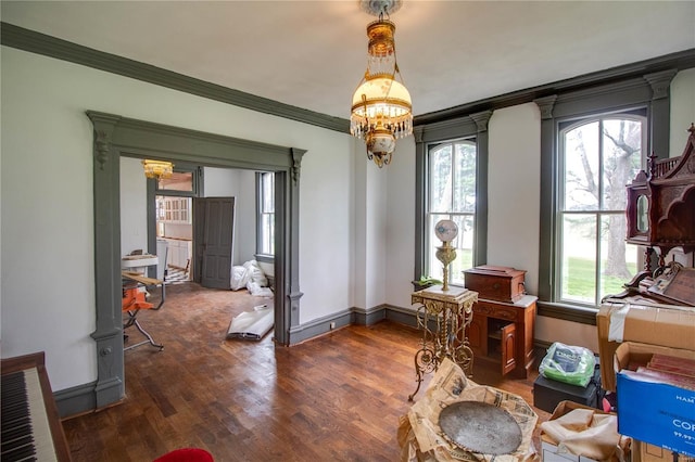 1508 State Route 140, Smithboro, IL 62284 - dining space with a chandelier, dark wood-style flooring, crown molding, and baseboards