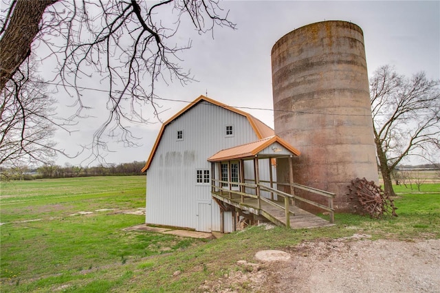 1508 State Route 140, Smithboro, IL 62284 - back of house featuring a gambrel roof, a chimney, an outbuilding, and a lawn