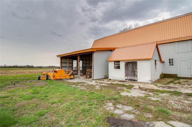 1508 State Route 140, Smithboro, IL 62284 - back of house featuring an outdoor structure, metal roof, concrete block siding, and an exterior structure