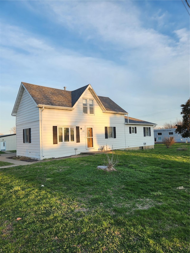 back of property with a yard