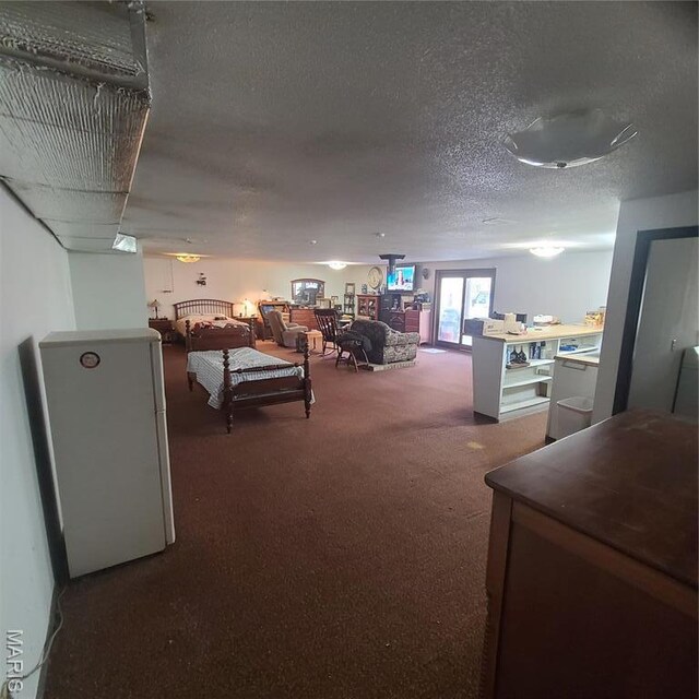 23026 Reporter Rd, Waynesville, MO 65583 - carpeted living area with a textured ceiling