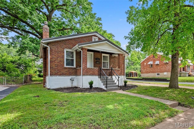 8315 Jefferson Ave, Vinita Park, MO 63114 - bungalow with a chimney, brick siding, and covered porch