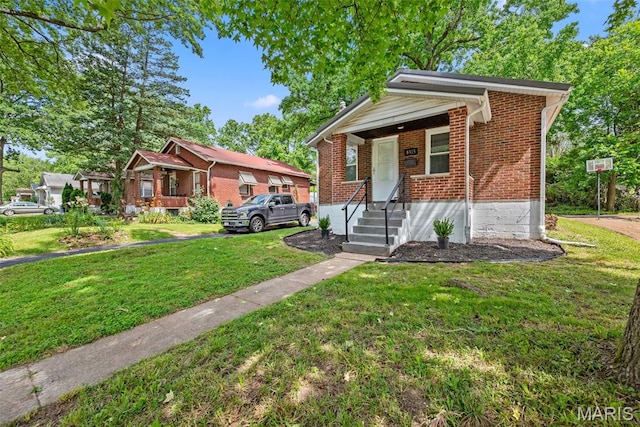 8315 Jefferson Ave, Vinita Park, MO 63114 - bungalow-style house with brick siding and a front yard