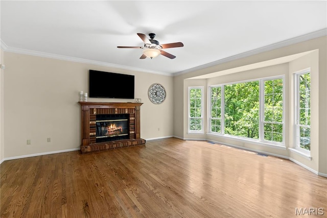 16112 Ridgewoods Manor Cir, Ellisville, MO 63038 - unfurnished living room with a ceiling fan, ornamental molding, wood finished floors, baseboards, and a brick fireplace