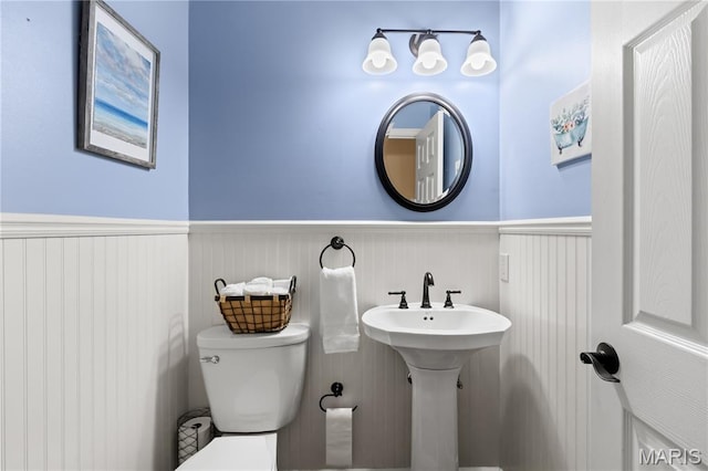 16112 Ridgewoods Manor Cir, Ellisville, MO 63038 - bathroom with wainscoting and toilet