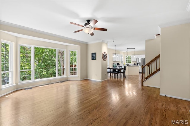 16112 Ridgewoods Manor Cir, Ellisville, MO 63038 - living area featuring a ceiling fan, stairway, wood finished floors, and baseboards